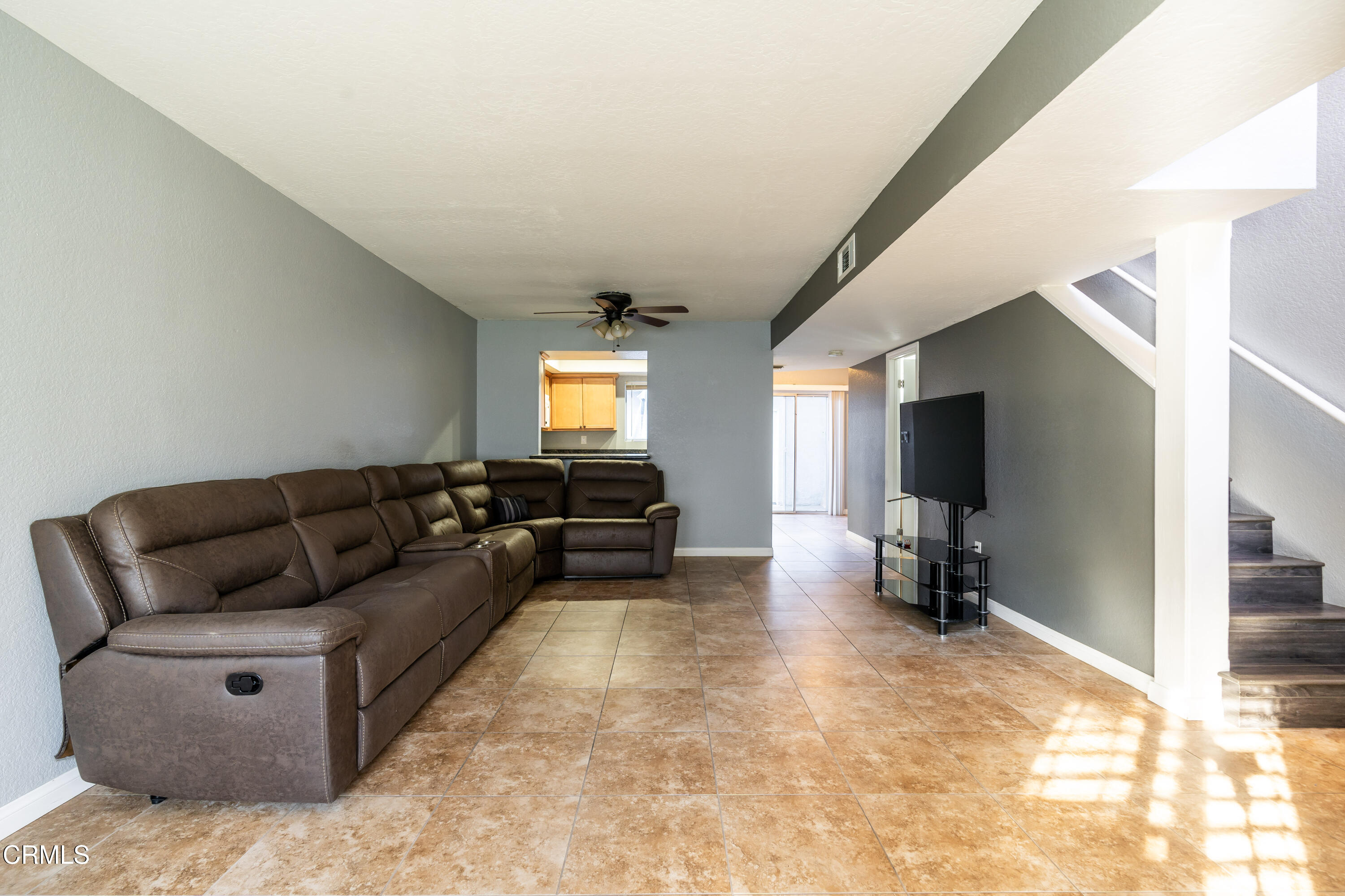 186 West Walnut Avenue, Unit E Rialto, CA 92376 - Photo 6 of 22 a living room with furniture and a flat screen tv