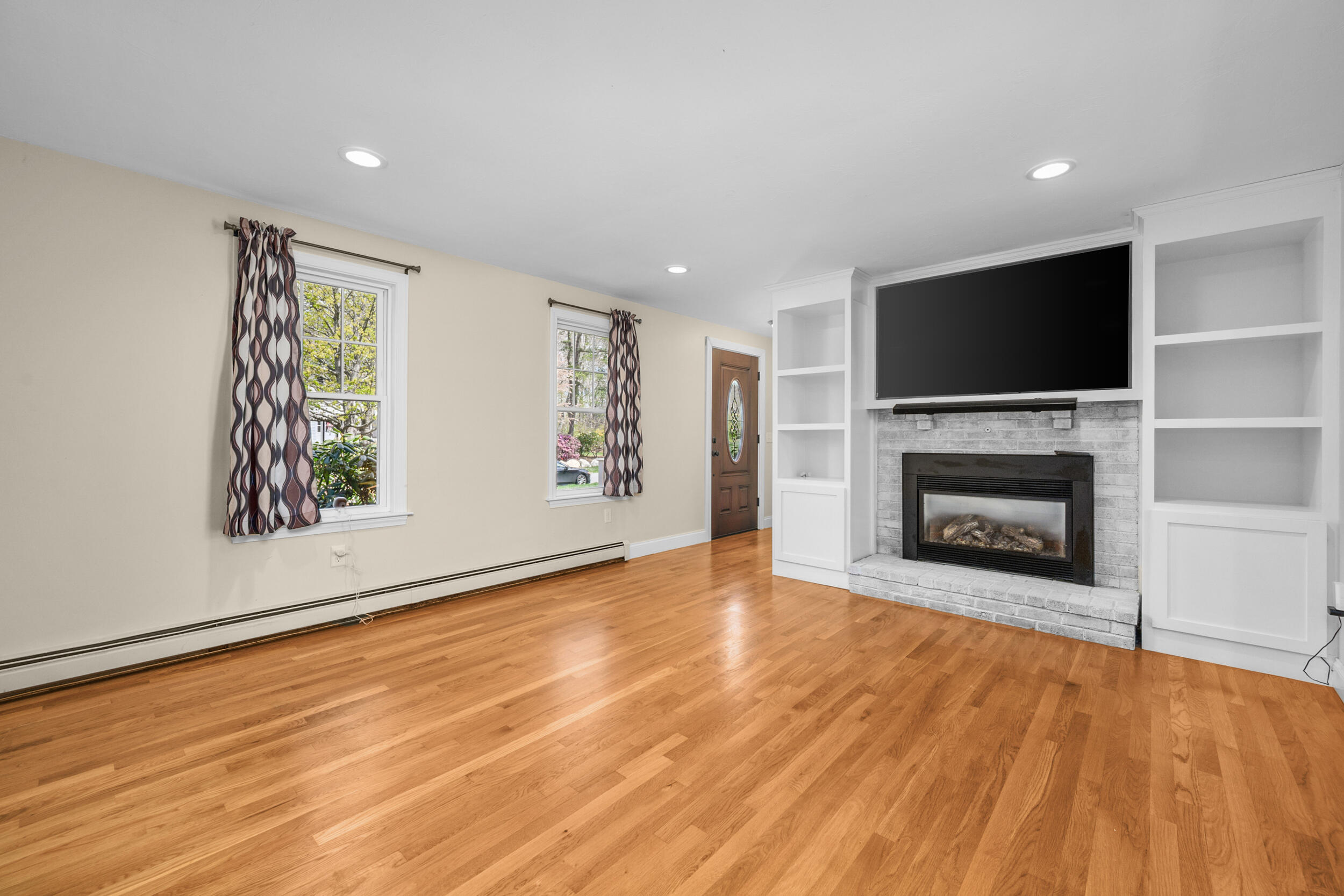 2 West Crossfield Road Forestdale, MA 02644 - Photo 14 of 41 a view of empty room with wooden floor and fireplace