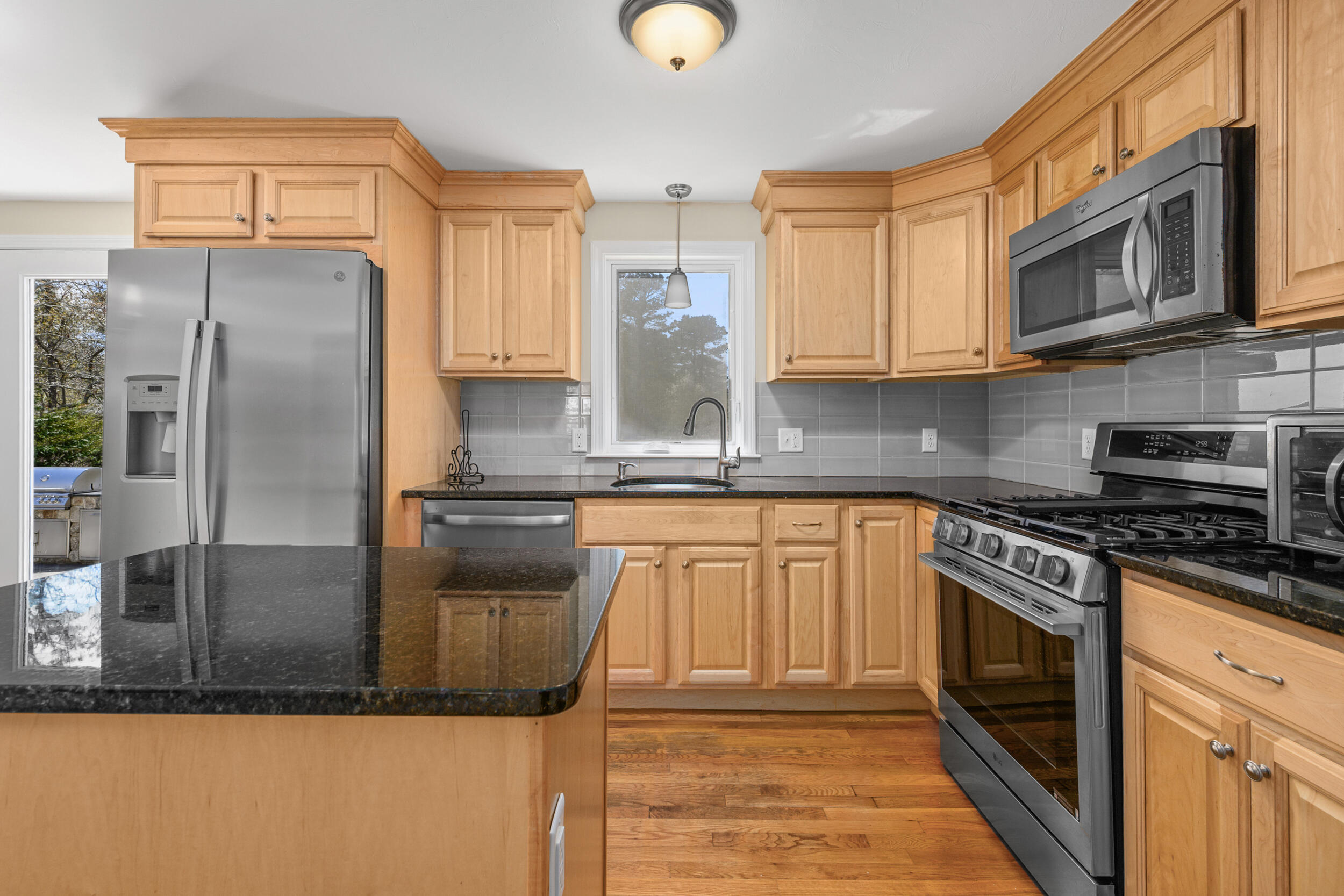 2 West Crossfield Road Forestdale, MA 02644 - Photo 19 of 41 a kitchen with stainless steel appliances granite countertop a stove a sink and a microwave