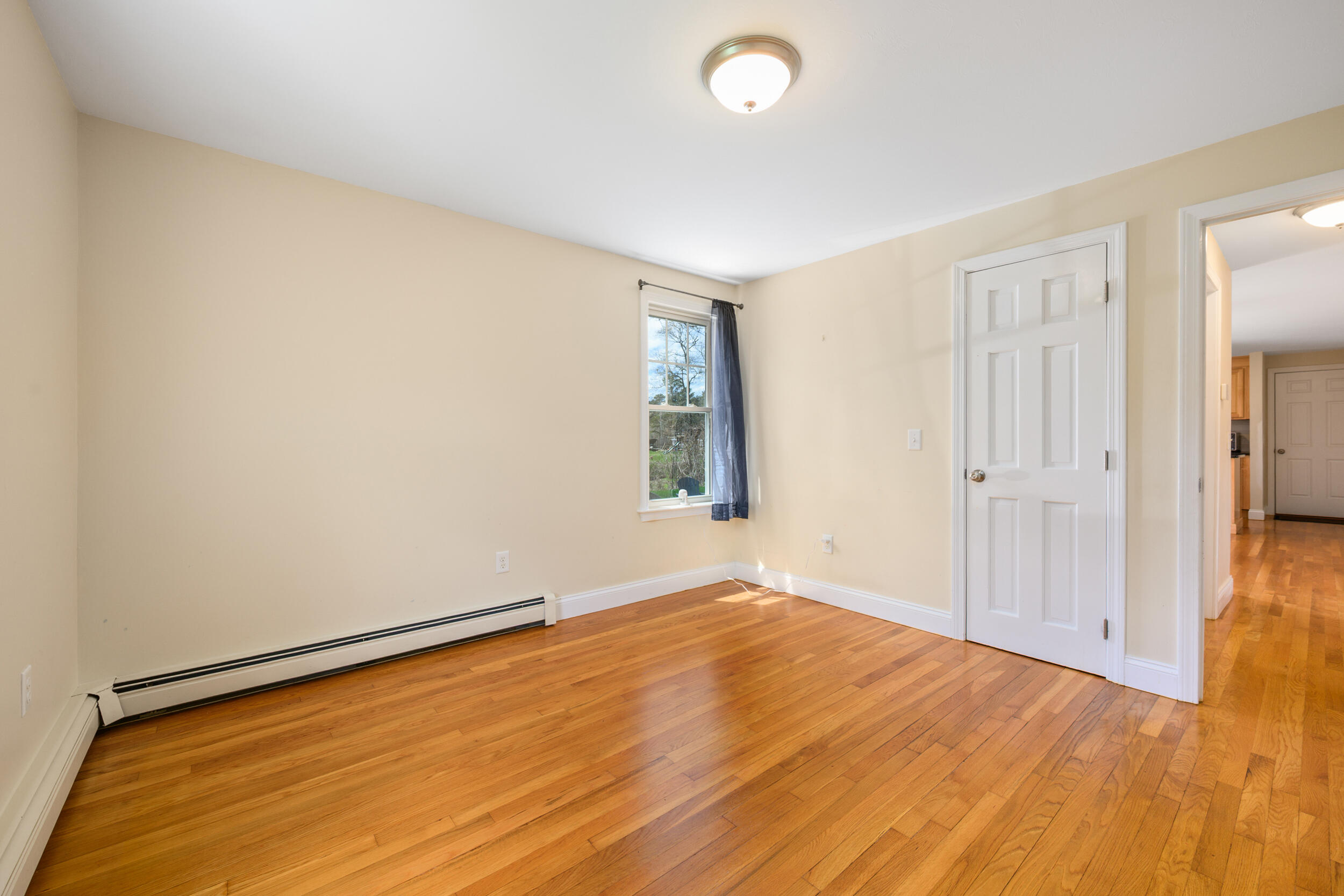 2 West Crossfield Road Forestdale, MA 02644 - Photo 26 of 41 an empty room with wooden floor and windows