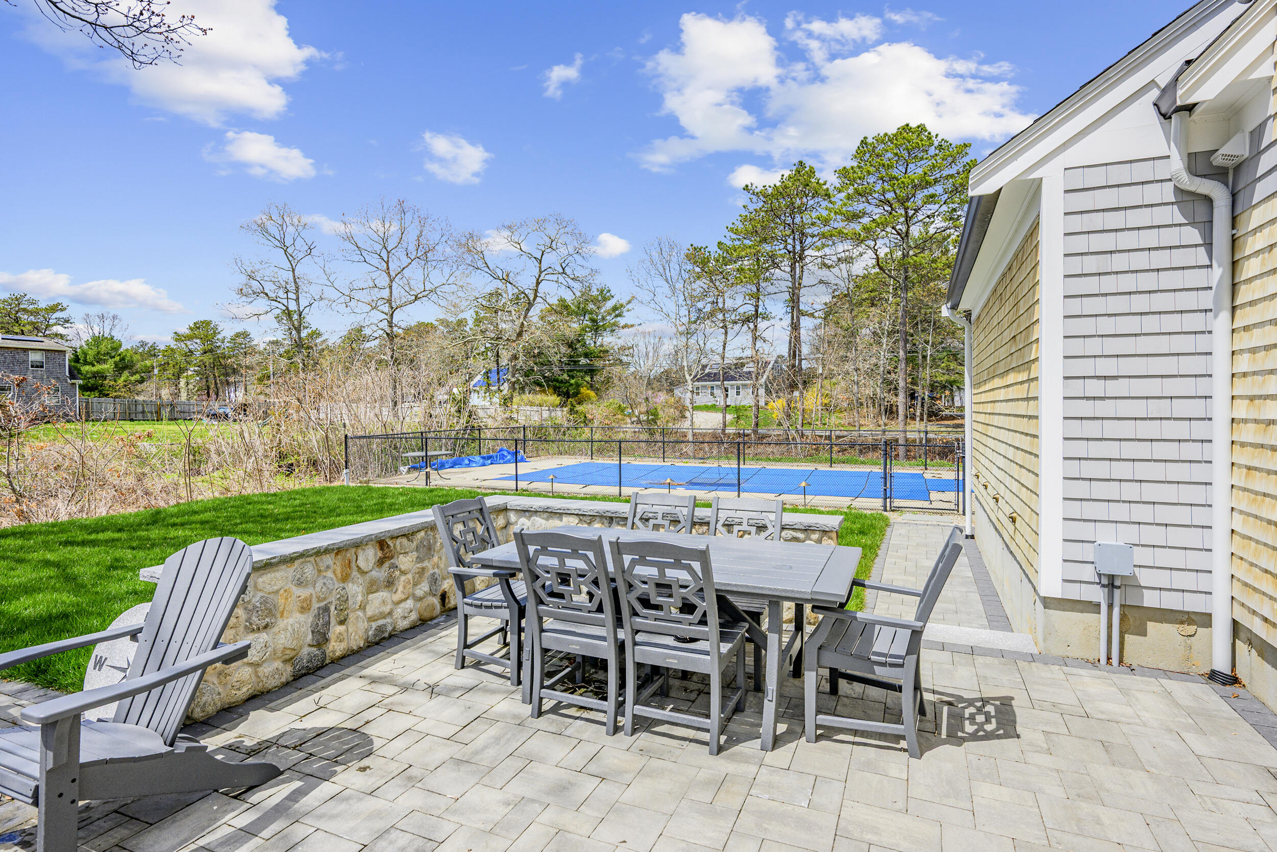 2 West Crossfield Road Forestdale, MA 02644 - Photo 6 of 41 a patio with a yard table and chairs