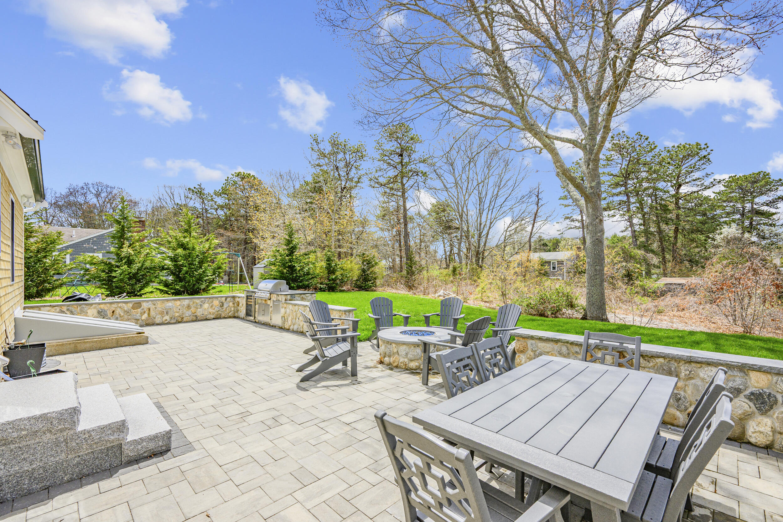 2 West Crossfield Road Forestdale, MA 02644 - Photo 7 of 41 a view of a patio with table and chairs and a large tree
