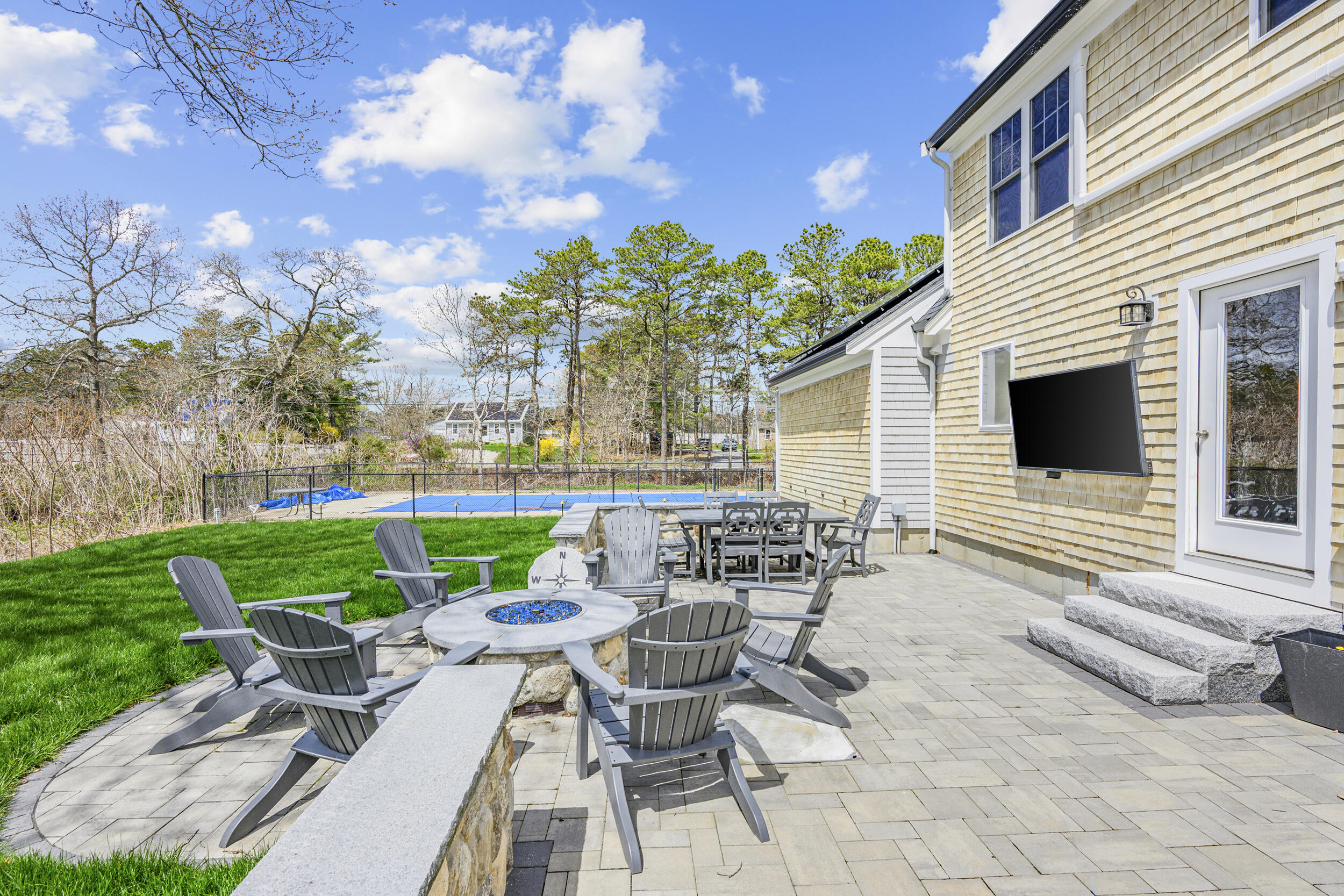 2 West Crossfield Road Forestdale, MA 02644 - Photo 9 of 41 a view of a patio with couches chairs and a yard