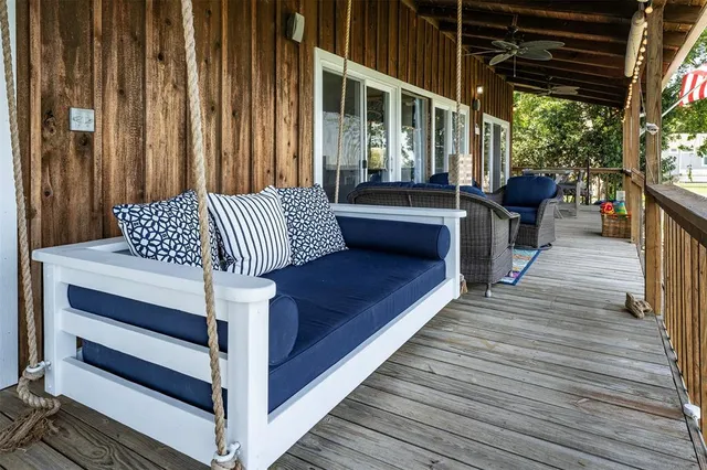 a balcony view with a seating space