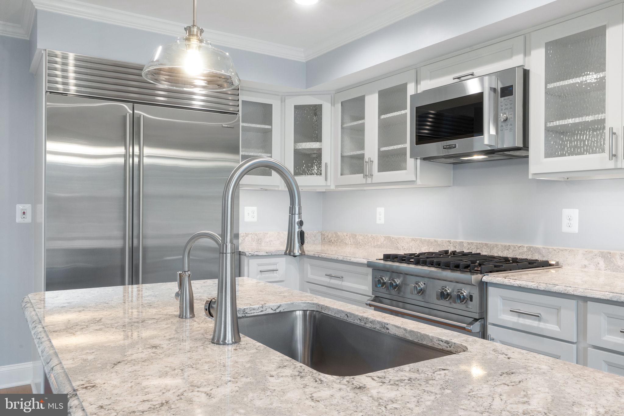 975 Phillips Drive Arnold, MD 21012 - Photo 13 of 93 a kitchen with a sink appliances and cabinets