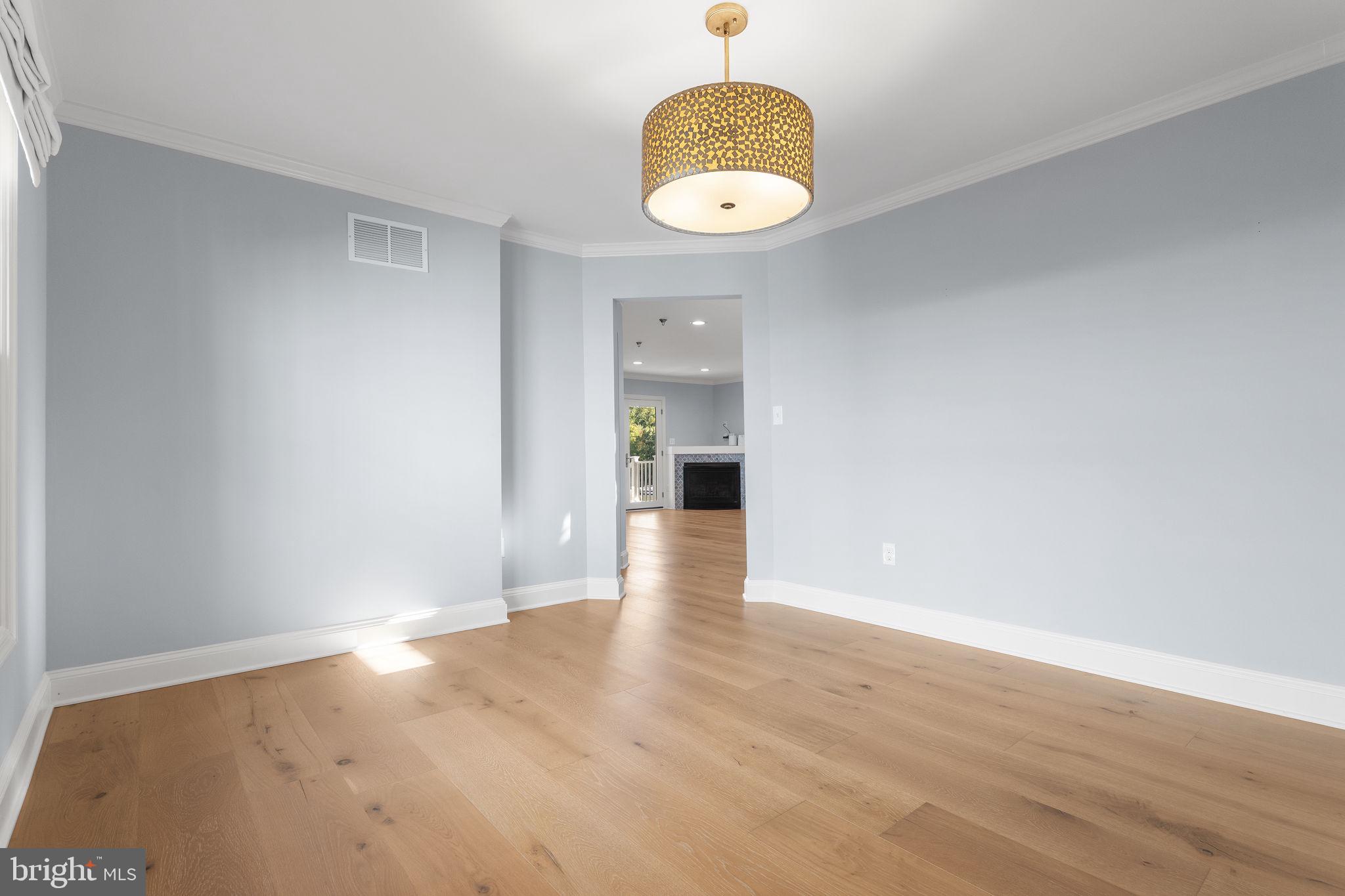 975 Phillips Drive Arnold, MD 21012 - Photo 17 of 93 an empty room with wooden floor and windows
