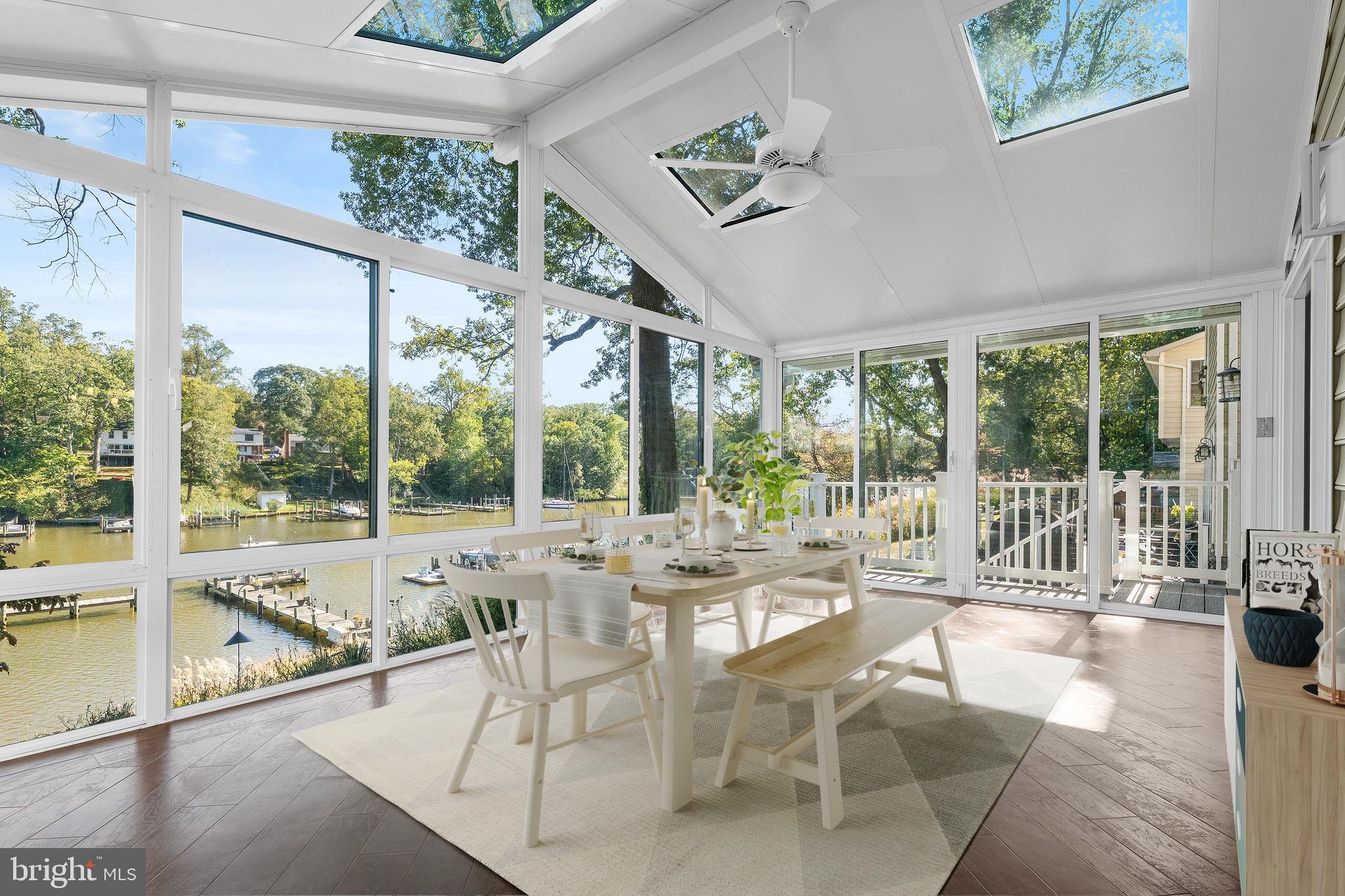 975 Phillips Drive Arnold, MD 21012 - Photo 19 of 93 a view of a dining room with furniture large windows and wooden floor