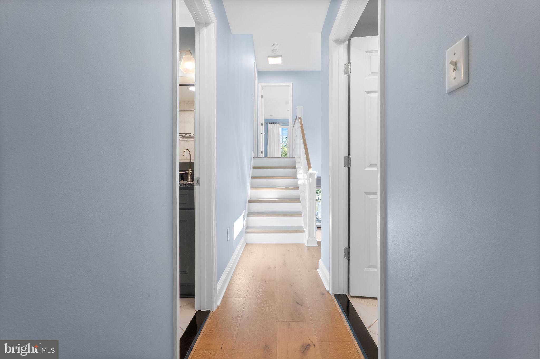 975 Phillips Drive Arnold, MD 21012 - Photo 27 of 93 a view of a hallway with wooden floor and staircase
