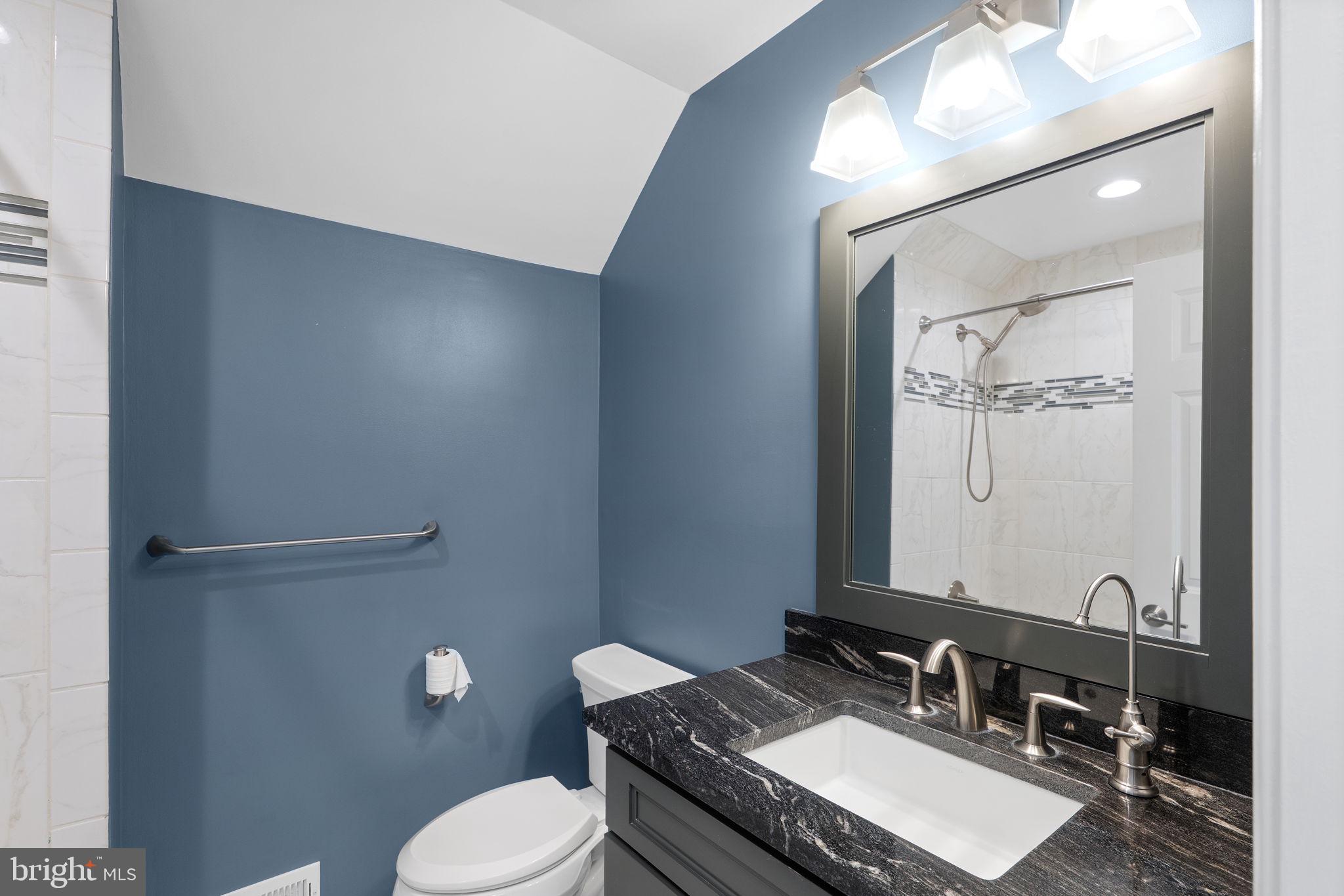 975 Phillips Drive Arnold, MD 21012 - Photo 28 of 93 a bathroom with a granite countertop sink vanity mirror and toilet