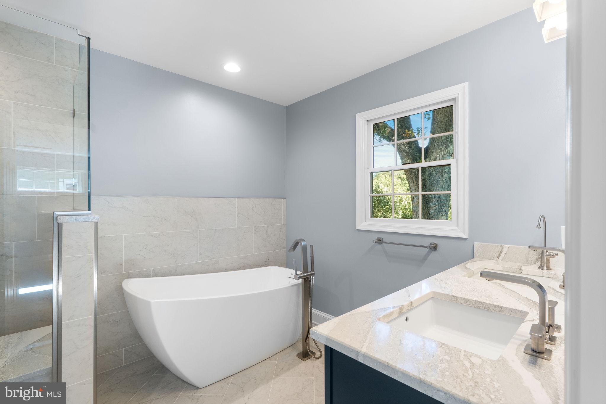 975 Phillips Drive Arnold, MD 21012 - Photo 42 of 93 a bathroom with a tub sink and window