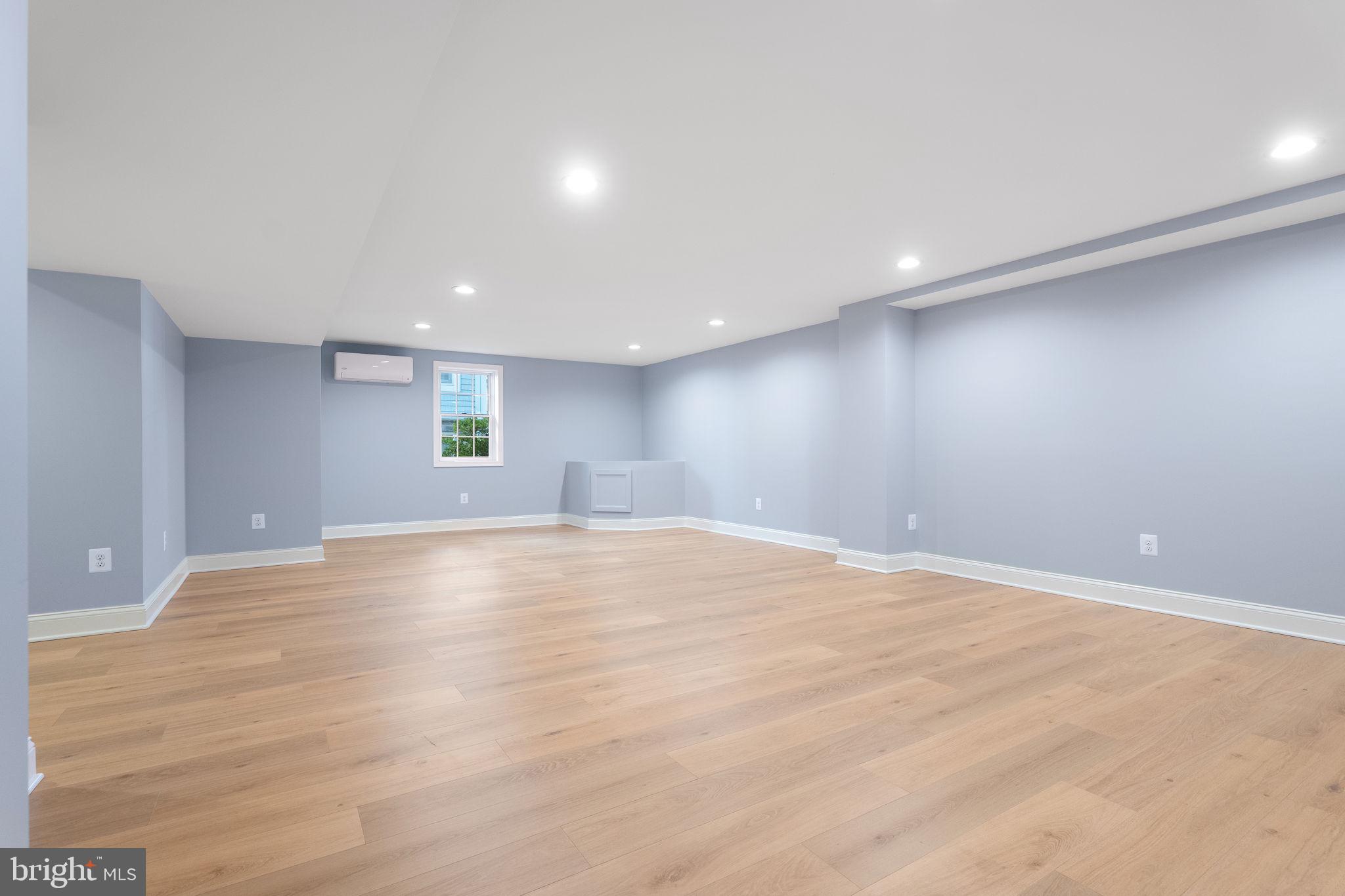 975 Phillips Drive Arnold, MD 21012 - Photo 50 of 93 a view of an empty room with wooden floor and windows