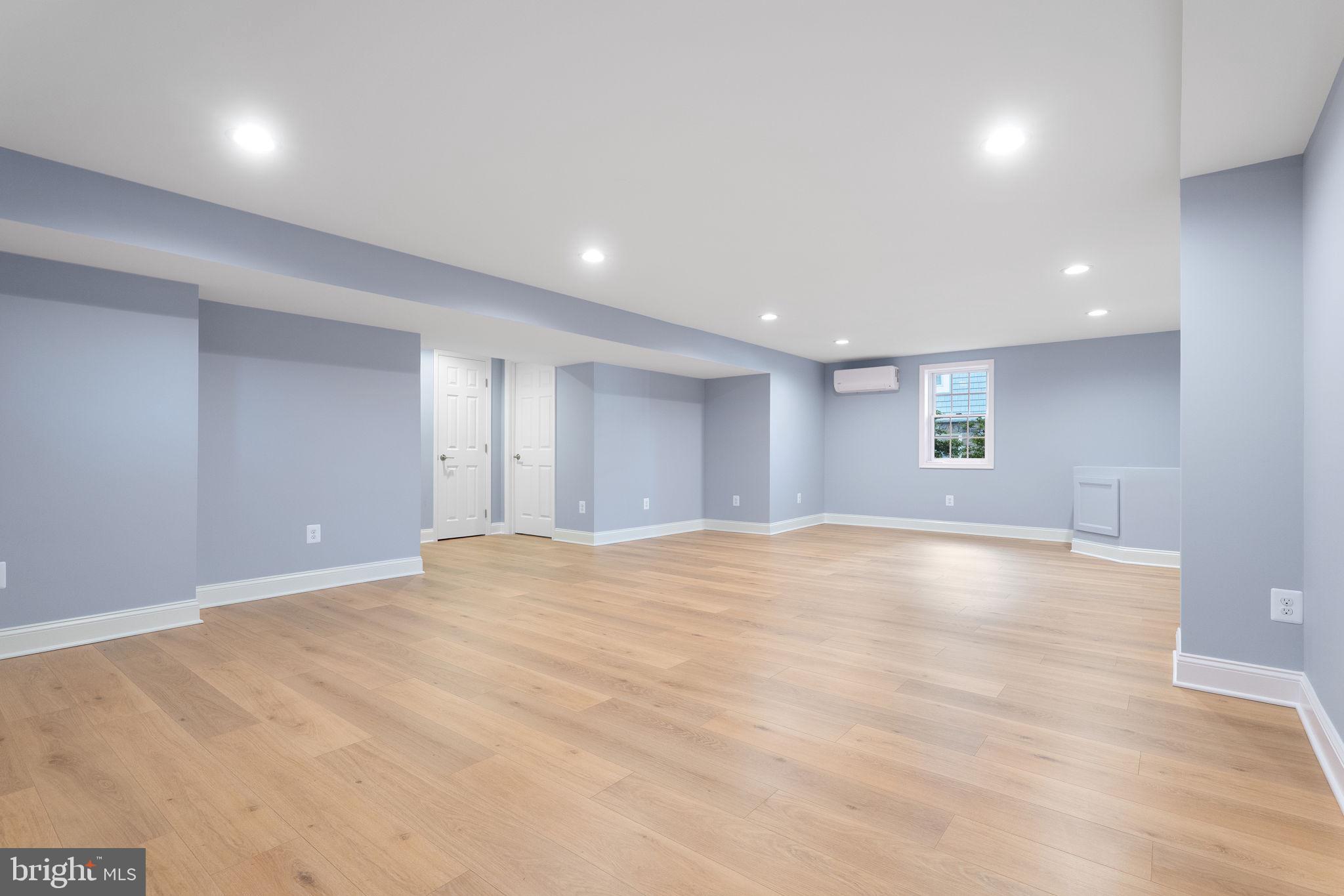 975 Phillips Drive Arnold, MD 21012 - Photo 51 of 93 a view of an empty room with window and wooden floor