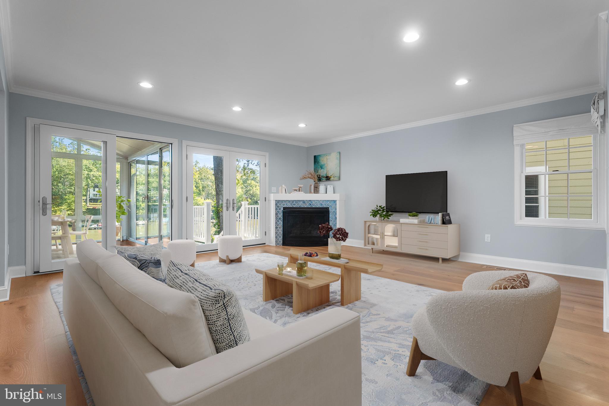 975 Phillips Drive Arnold, MD 21012 - Photo 7 of 93 a living room with furniture a flat screen tv and a large window
