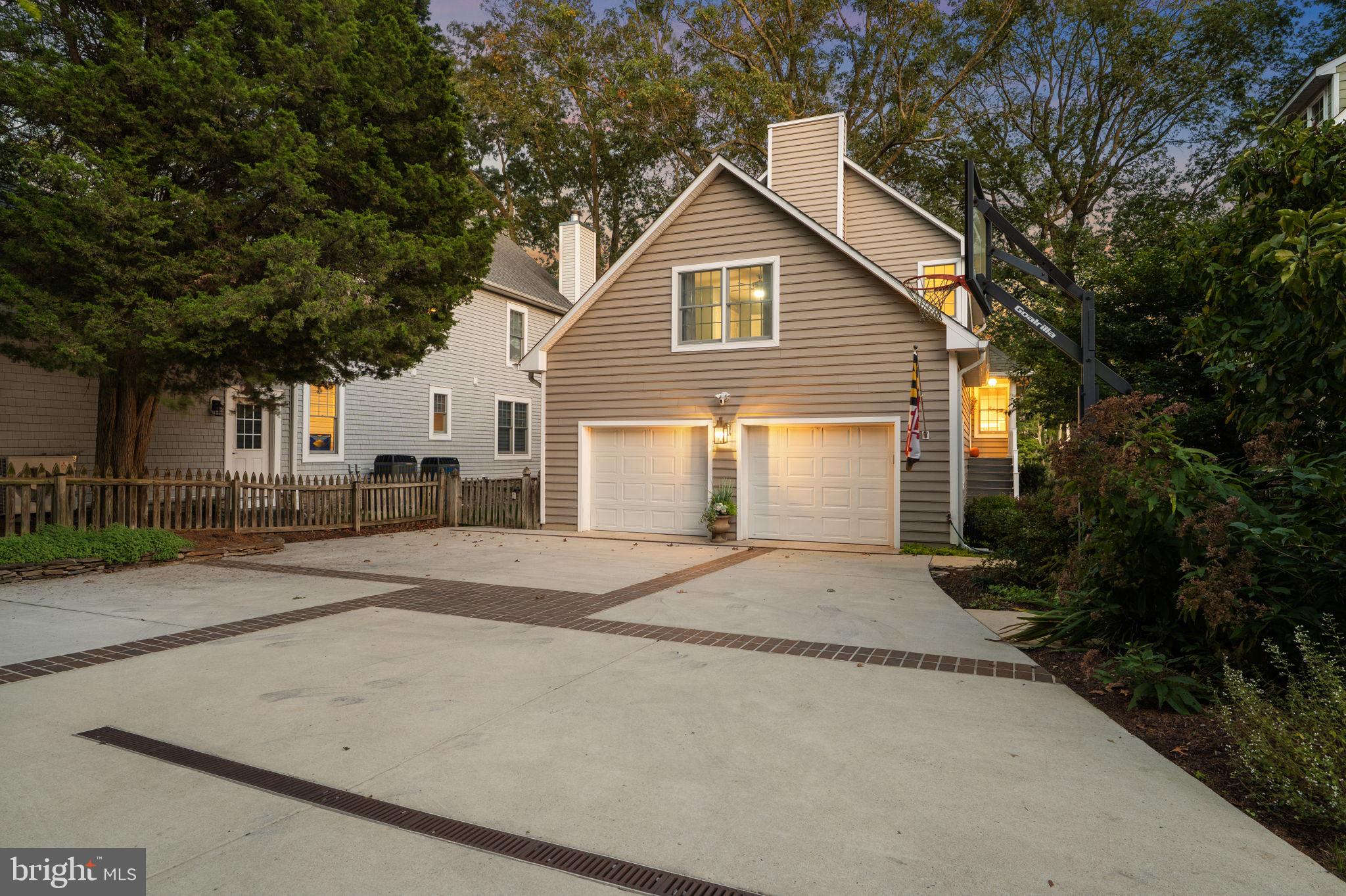 975 Phillips Drive Arnold, MD 21012 - Photo 81 of 93 a front view of a house with a yard and garage