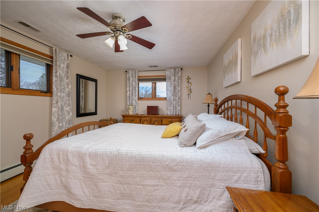 5304 Sibila Road Northwest Canton, OH 44718 - Photo 25 of 29 Bedroom featuring light wood-type flooring and ceiling fan
