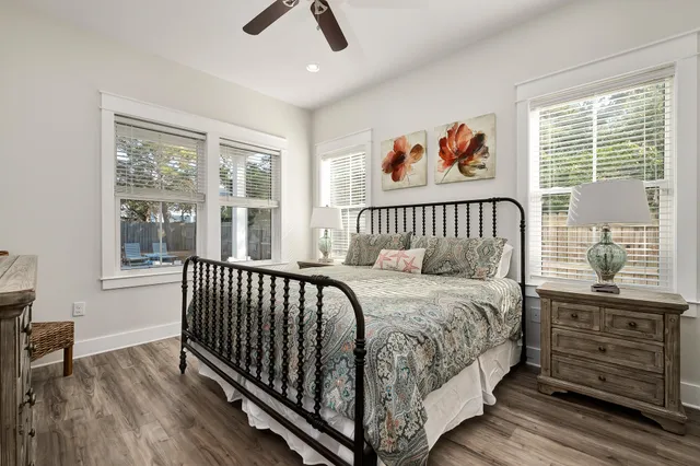 a bed sitting in a bedroom next to a window