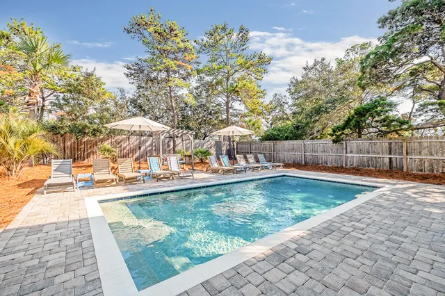 a view of a swimming pool with a patio