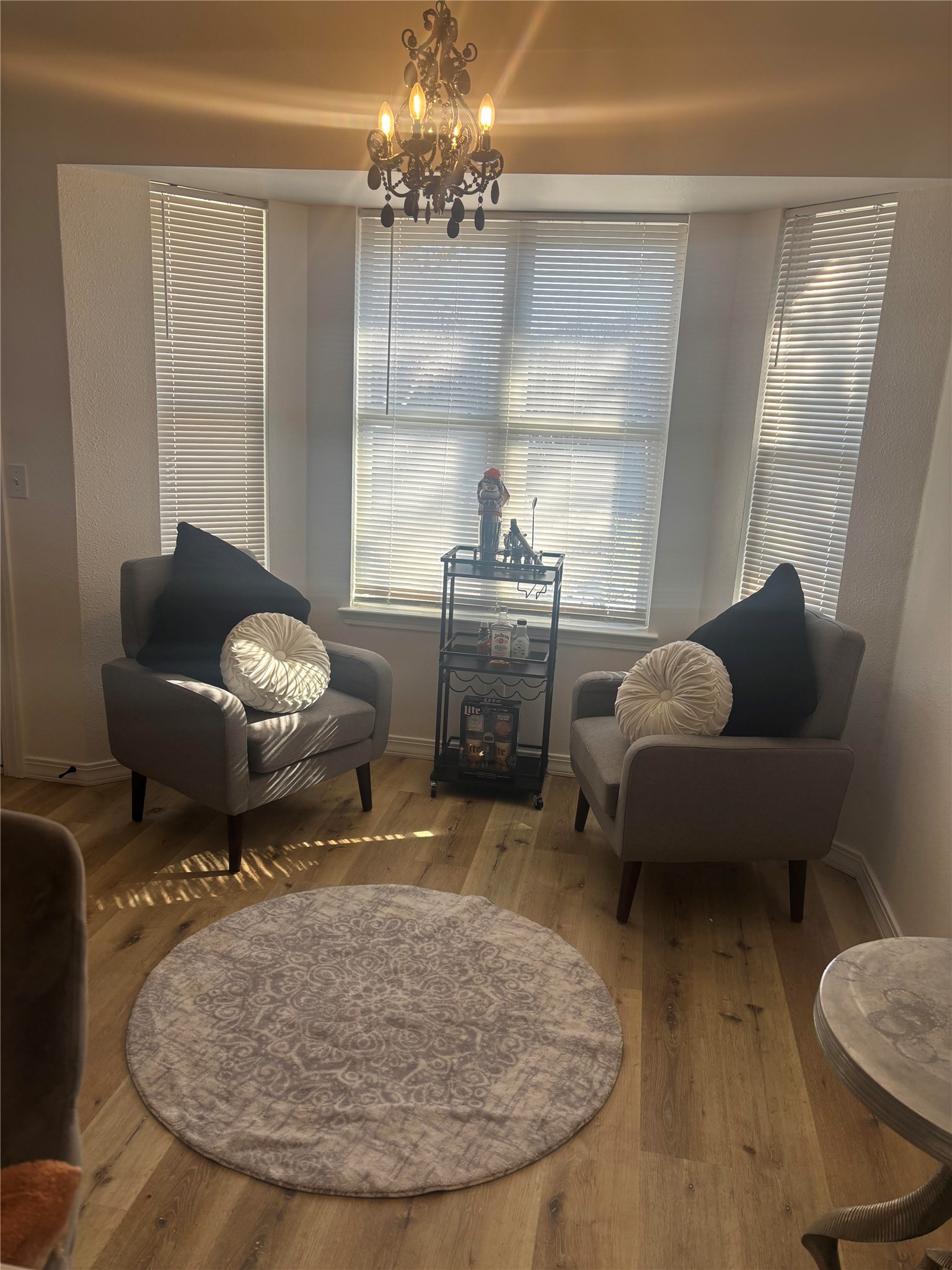 810 Honeysuckle Drive Leander, TX 78641 - Photo 5 of 9 a living room with furniture and a chandelier