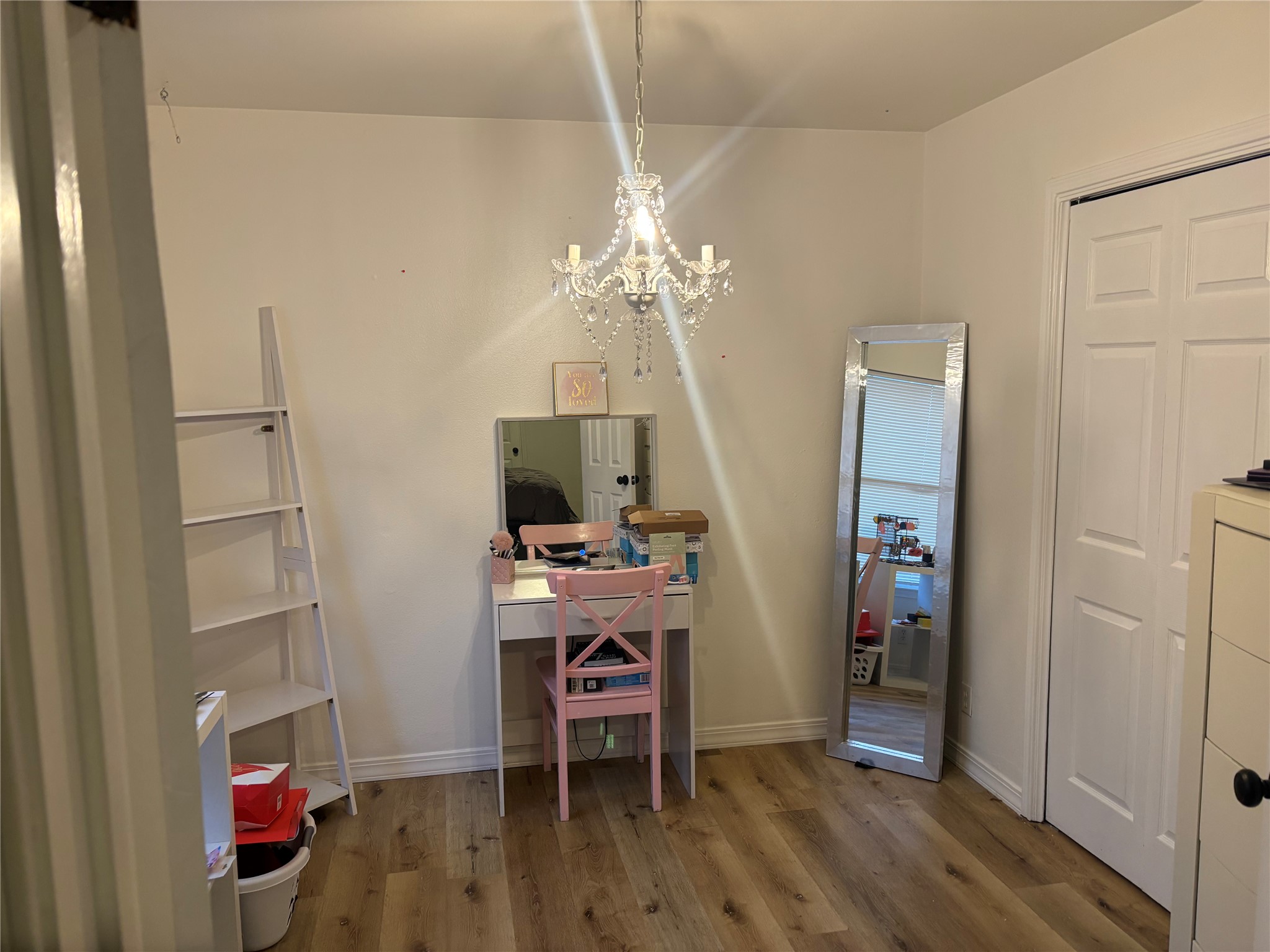 810 Honeysuckle Drive Leander, TX 78641 - Photo 8 of 9 a view of a workspace with furniture and wooden floor