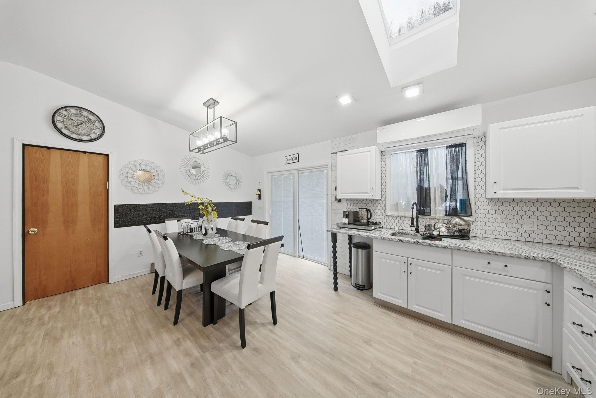 4 Ray Lane Loch Sheldrake, NY 12759 - Photo 11 of 29 a kitchen with stainless steel appliances granite countertop a stove a sink dishwasher and a refrigerator with wooden floor