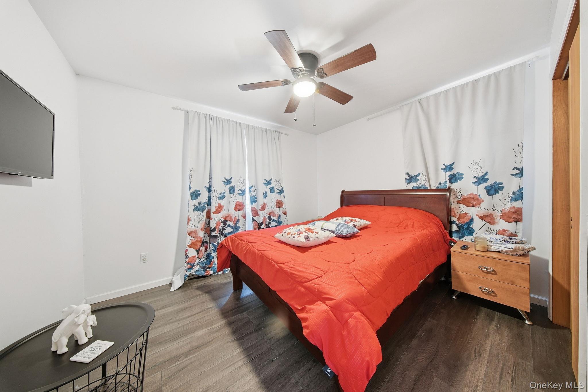 4 Ray Lane Loch Sheldrake, NY 12759 - Photo 13 of 29 a room with a bed and a flat screen tv