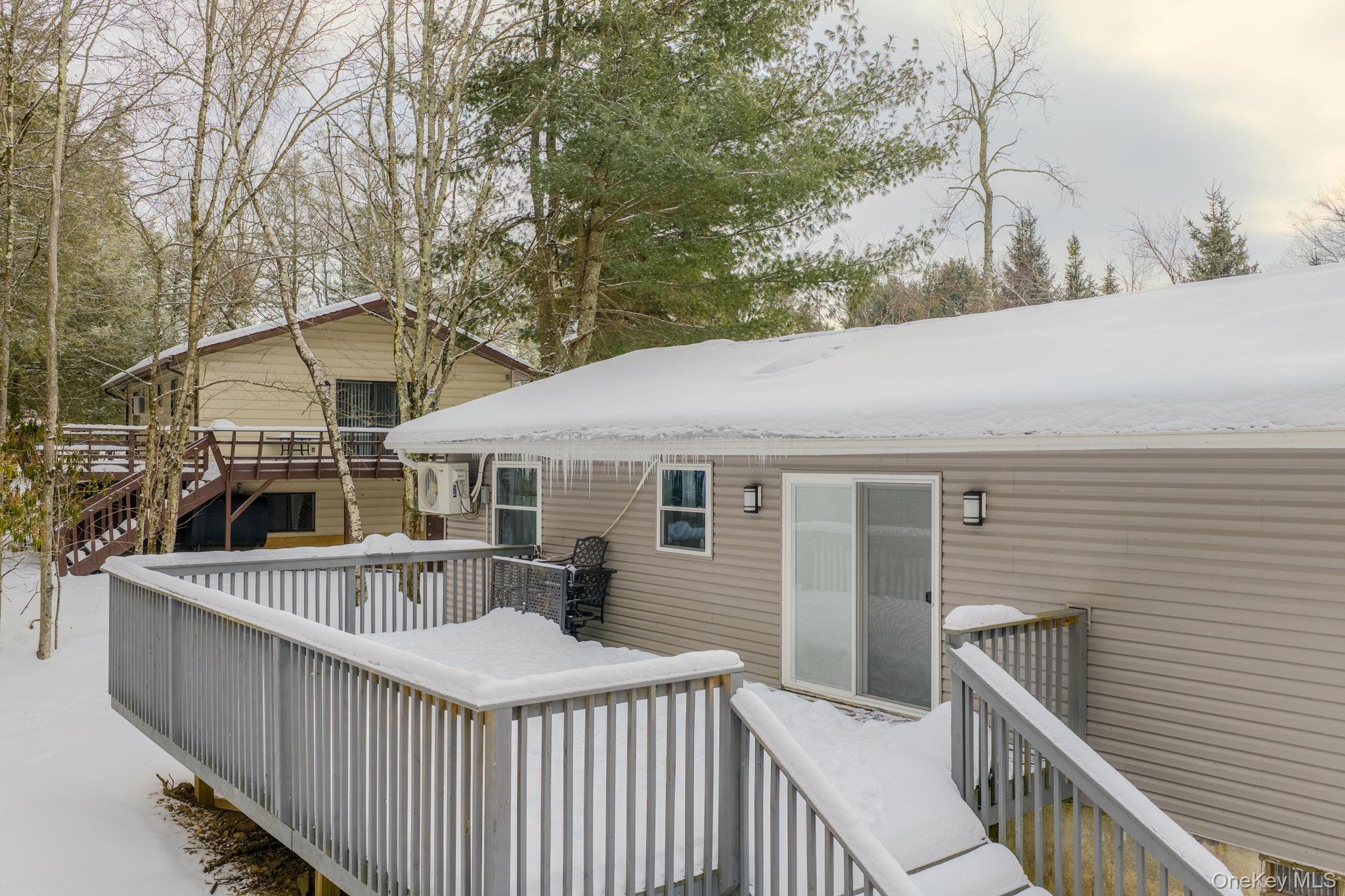 4 Ray Lane Loch Sheldrake, NY 12759 - Photo 20 of 29 a view of a house with wooden fence