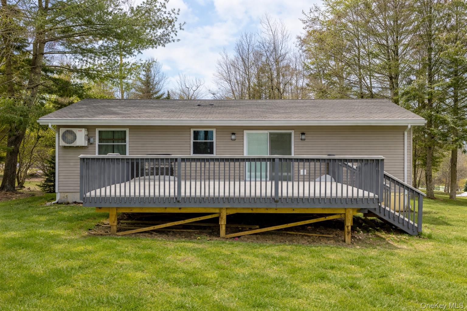 4 Ray Lane Loch Sheldrake, NY 12759 - Photo 2 of 29 a view of a house with a deck and a yard