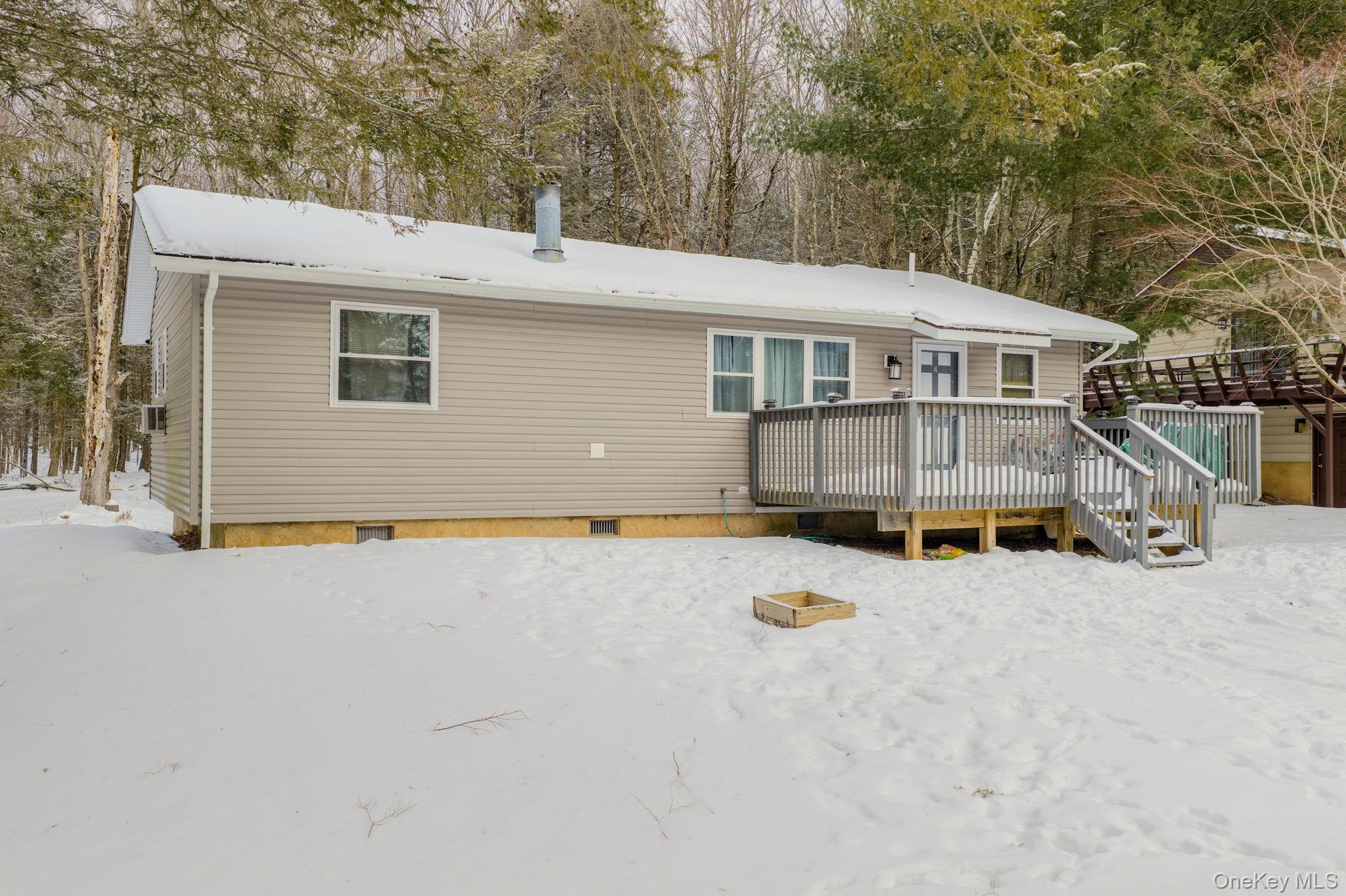 4 Ray Lane Loch Sheldrake, NY 12759 - Photo 22 of 29 a view of a house with a yard and covered with snow