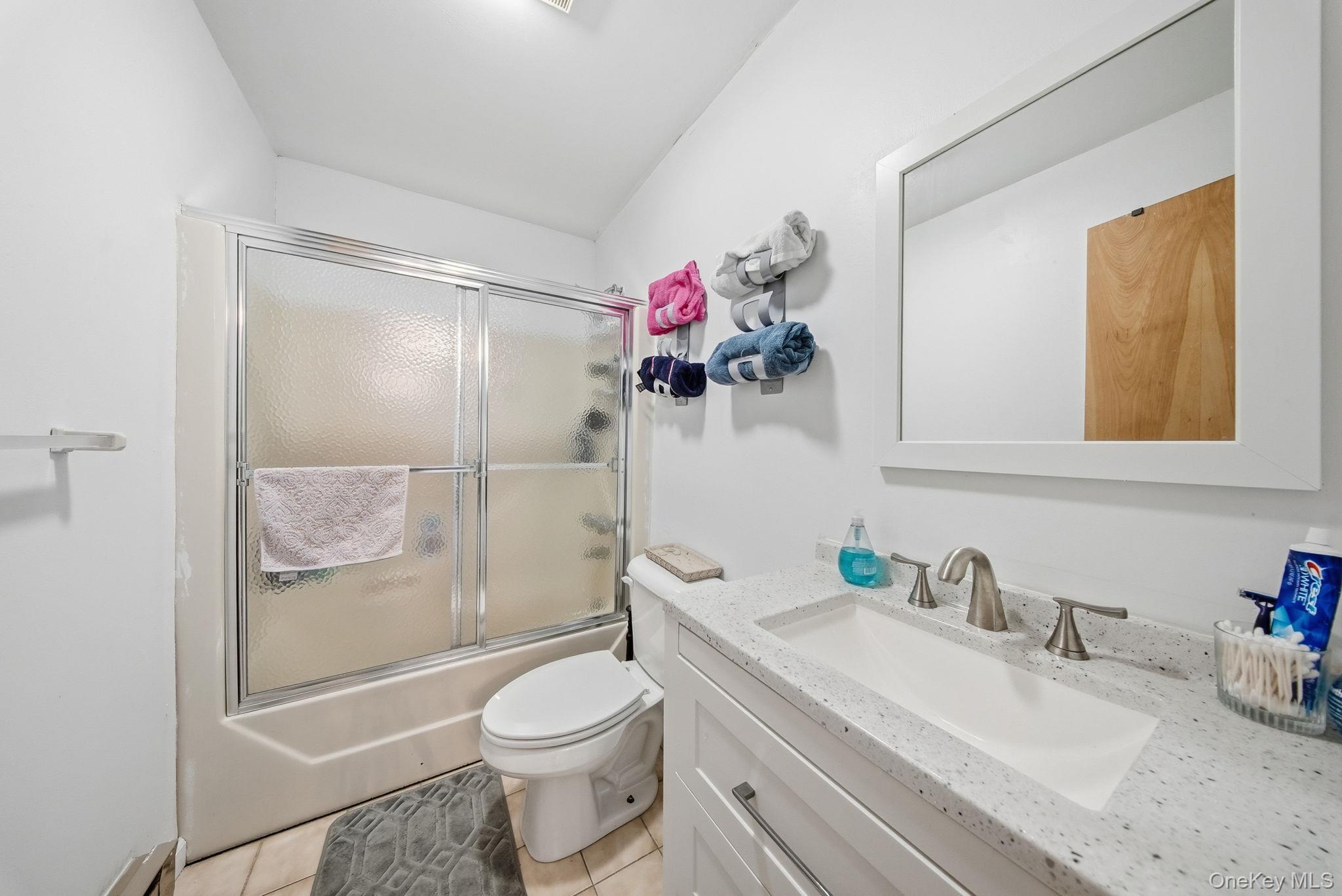 4 Ray Lane Loch Sheldrake, NY 12759 - Photo 10 of 23 a bathroom with a granite countertop sink toilet and shower