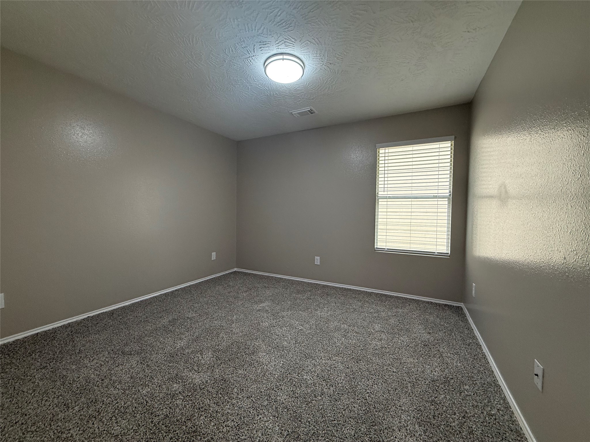 11423 Moonlight Ridge Drive Humble, TX 77396 - Photo 14 of 19 Secondary bedroom without any furniture.