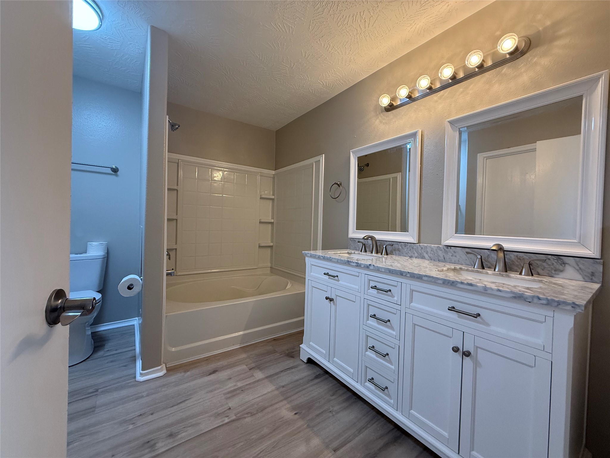 11423 Moonlight Ridge Drive Humble, TX 77396 - Photo 18 of 19 The primary bathroom includes a new vanity with double sinks, new toiler and large soaking tub/shower.