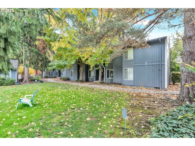 a backyard of a house with lots of green space