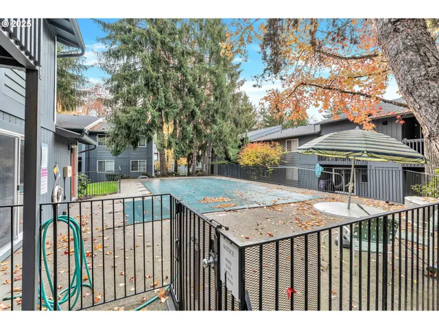 a view of a brick house with a large windows