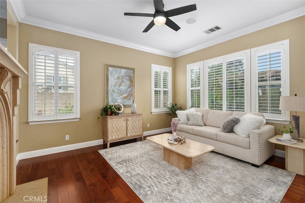 13337 Hunt Club Drive Rancho Cucamonga, CA 91739 - Photo 14 of 45 Living room with ceiling fan and shutters