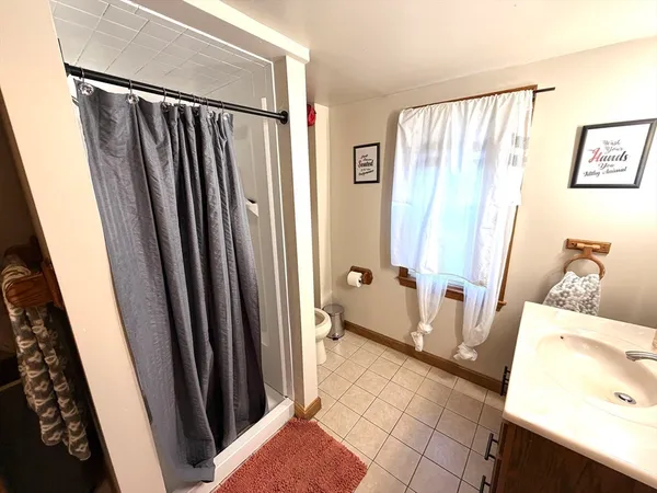 a view of a bathroom with a sink and a mirror