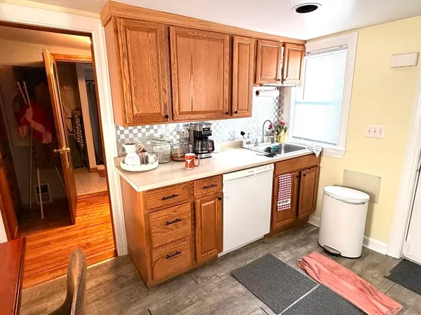 a kitchen with a sink and a stove top oven