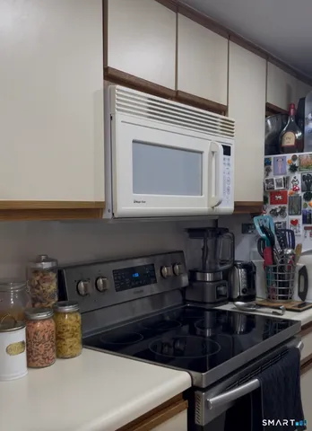 a kitchen with a stove and cabinets