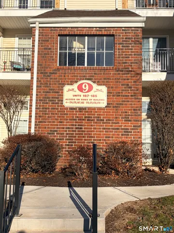 a brick building with a door and windows