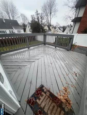 a view of balcony with wooden floor
