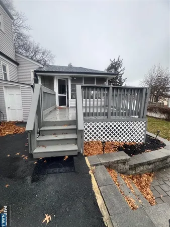 a view of a yard with wooden fence