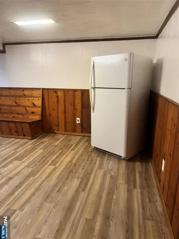 a view of a refrigerator in a kitchen