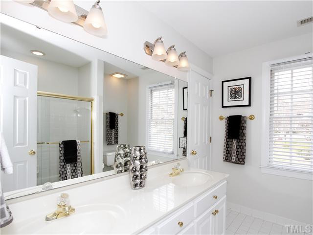 2021 Carrbridge Way Raleigh, NC 27615 - Photo 21 of 25 GUEST BATH, FRESHLY PAINTED, WITH DOUBLE VANITY, LOTS OF STORAGE, LARGE WINDOW, UPDATED LIGHTING. Bathroom