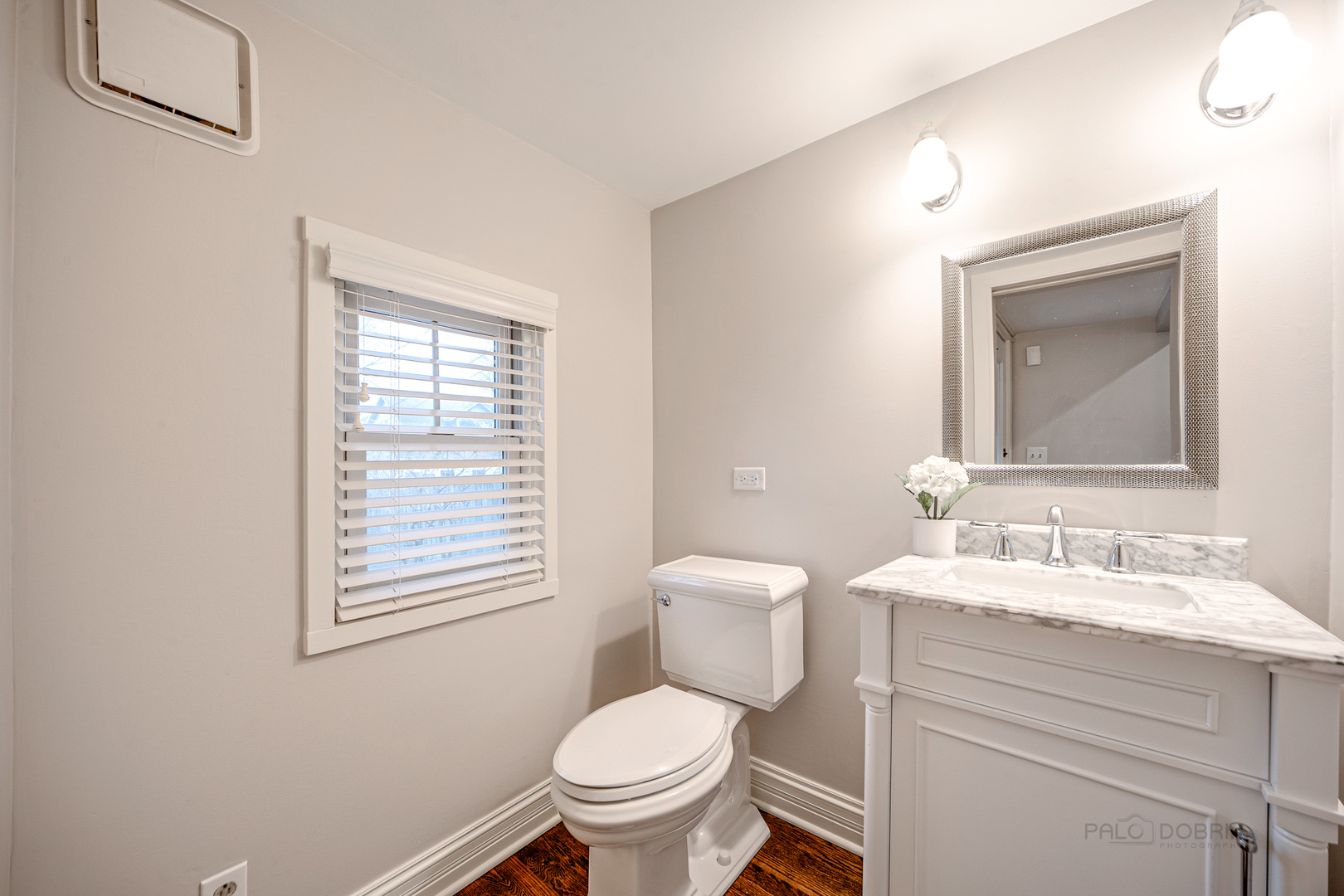 1214 Griffith Road Lake Forest, IL 60045 - Photo 11 of 24 a bathroom with a toilet sink and mirror