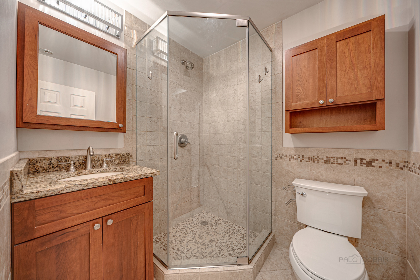 1214 Griffith Road Lake Forest, IL 60045 - Photo 14 of 24 a bathroom with a granite countertop toilet sink and mirror