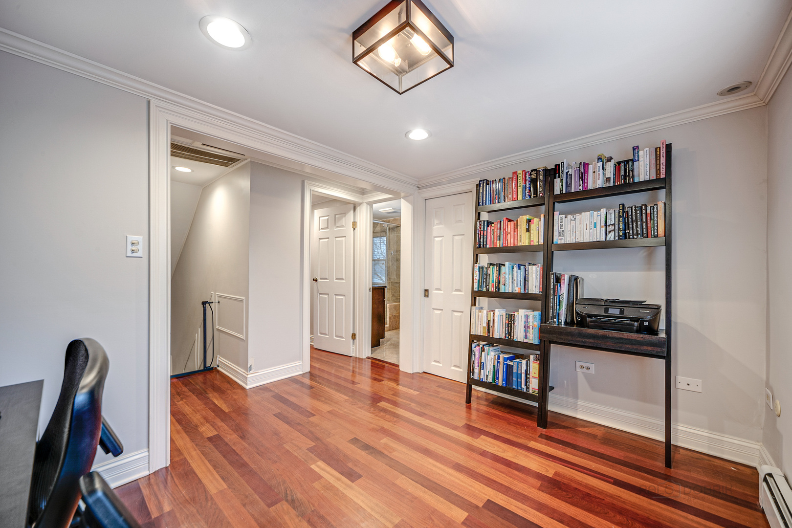 1214 Griffith Road Lake Forest, IL 60045 - Photo 17 of 24 a view of a hallway with wooden floor and furniture