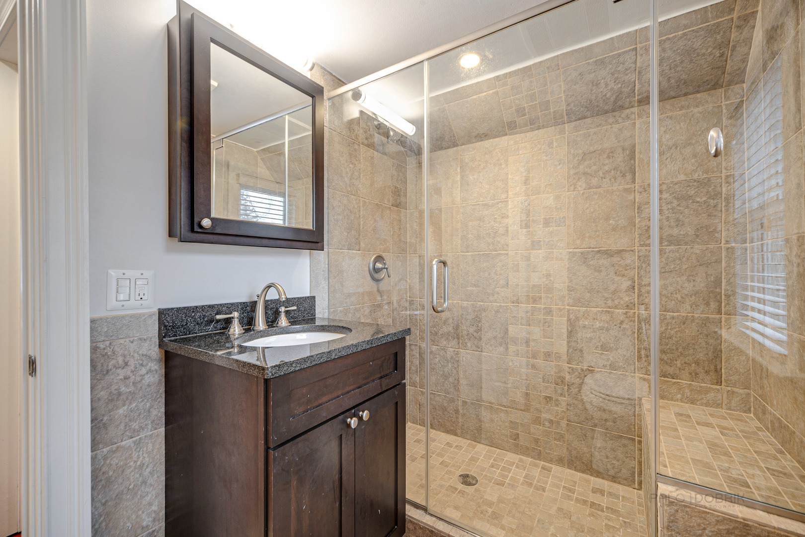 1214 Griffith Road Lake Forest, IL 60045 - Photo 18 of 24 a bathroom with a sink and a mirror