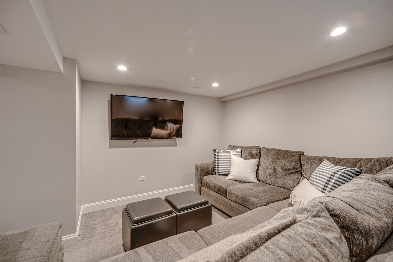 1214 Griffith Road Lake Forest, IL 60045 - Photo 20 of 24 a living room with furniture and a flat screen tv