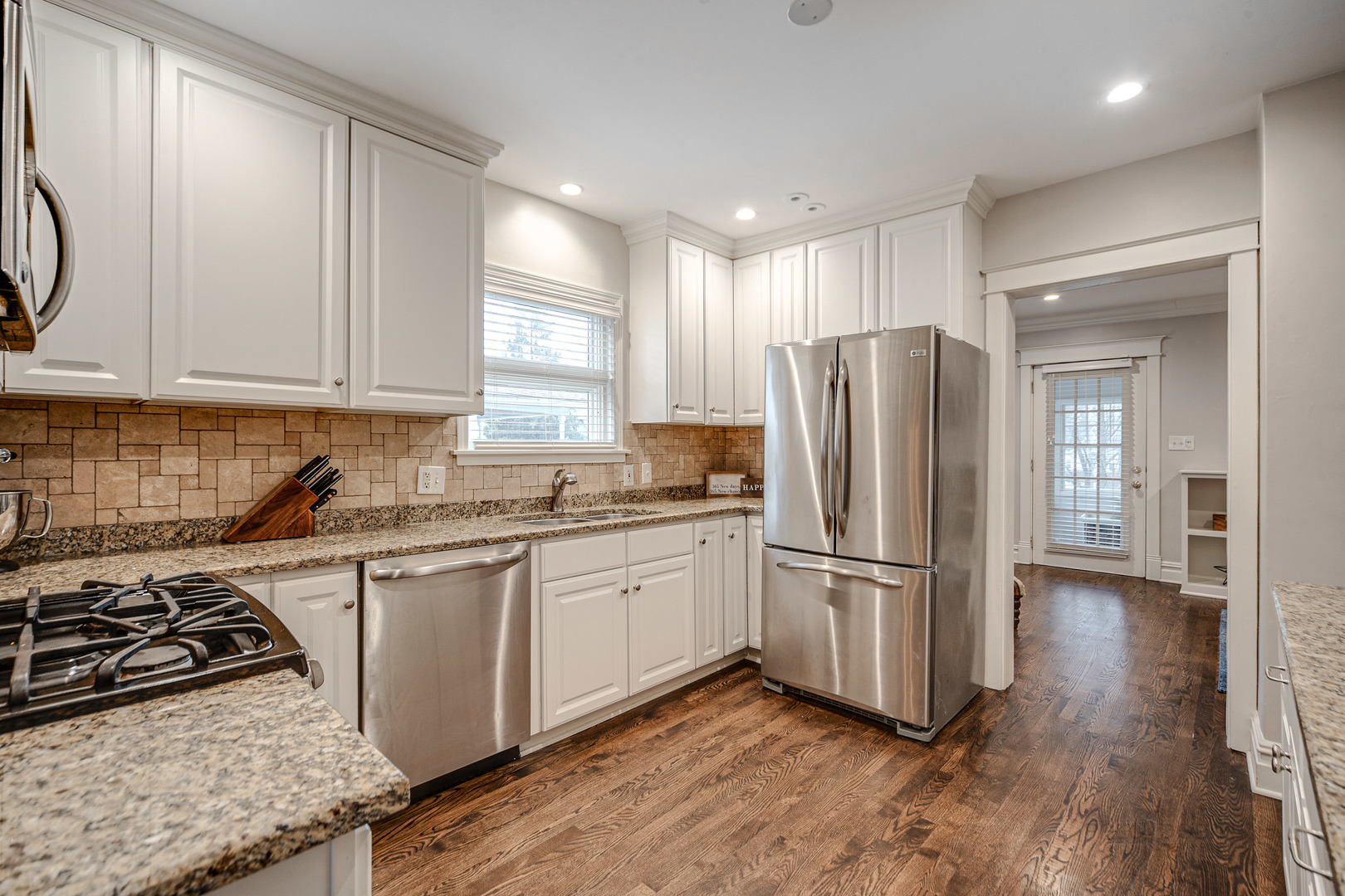 1214 Griffith Road Lake Forest, IL 60045 - Photo 8 of 24 a kitchen with stainless steel appliances granite countertop a stove a refrigerator and a sink