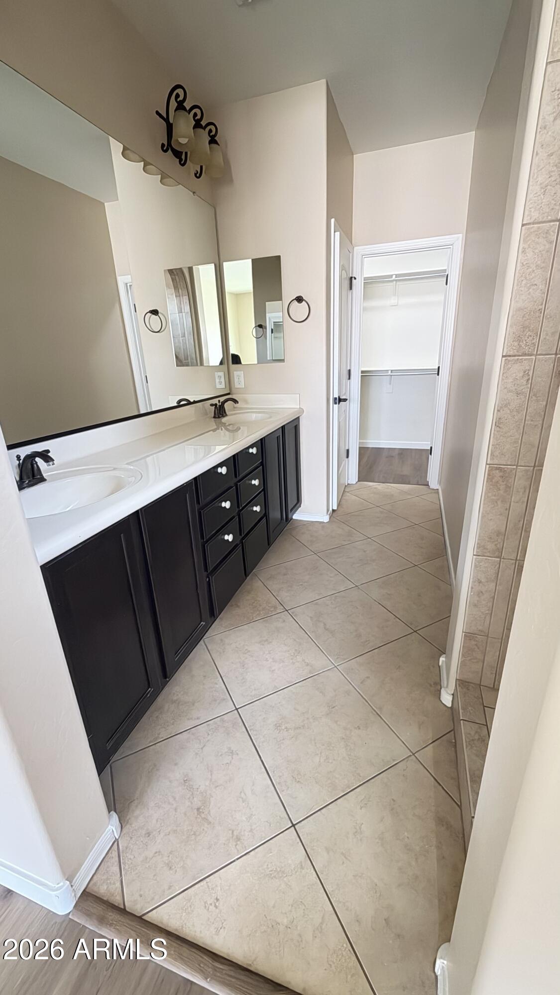 10786 West Yearling Road Peoria, AZ 85383 - Photo 10 of 21 a bathroom with a double vanity sink and mirror