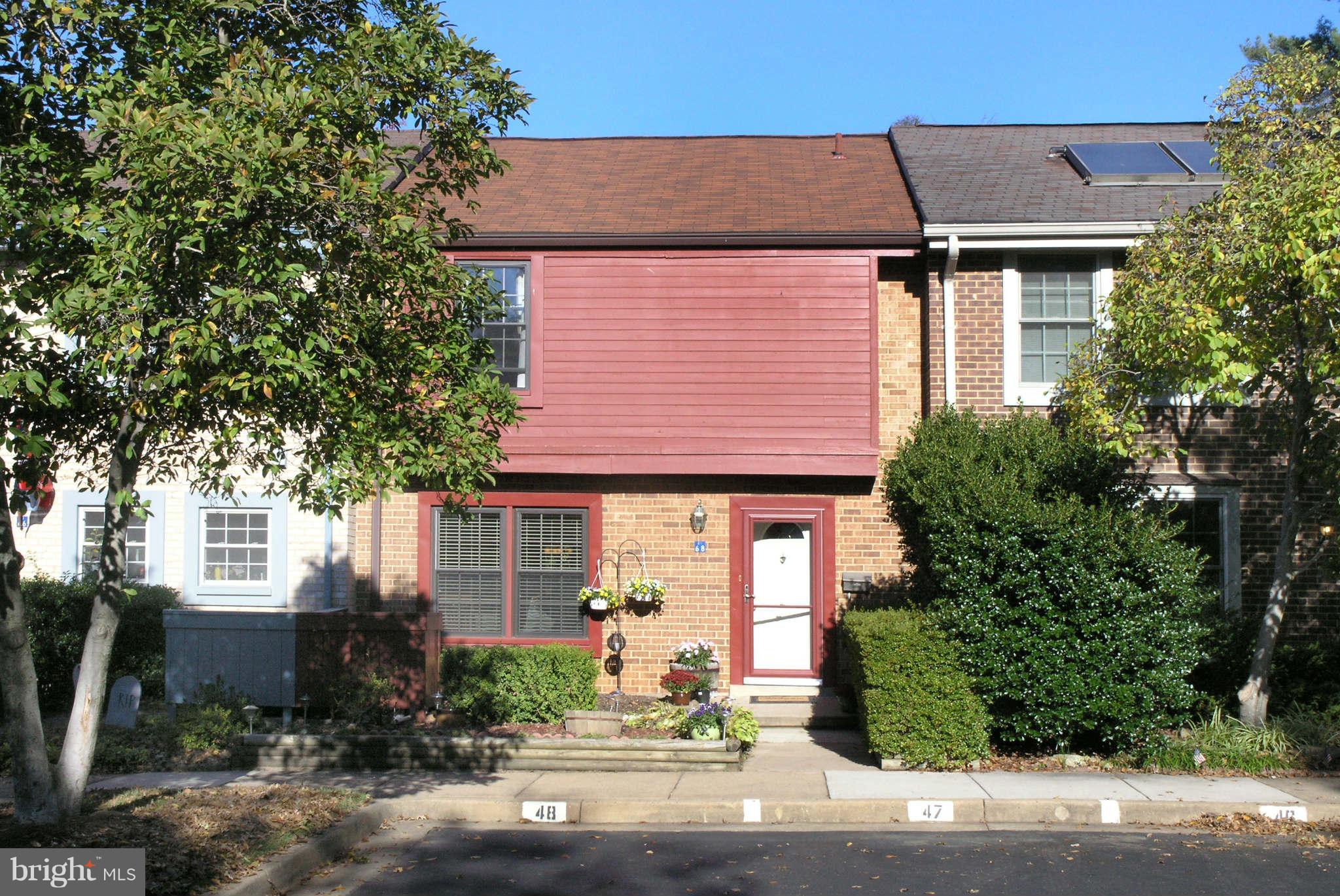 2168 Golf Course Drive Reston, VA 20191 - Photo 1 of 30 a front view of a house with a yard